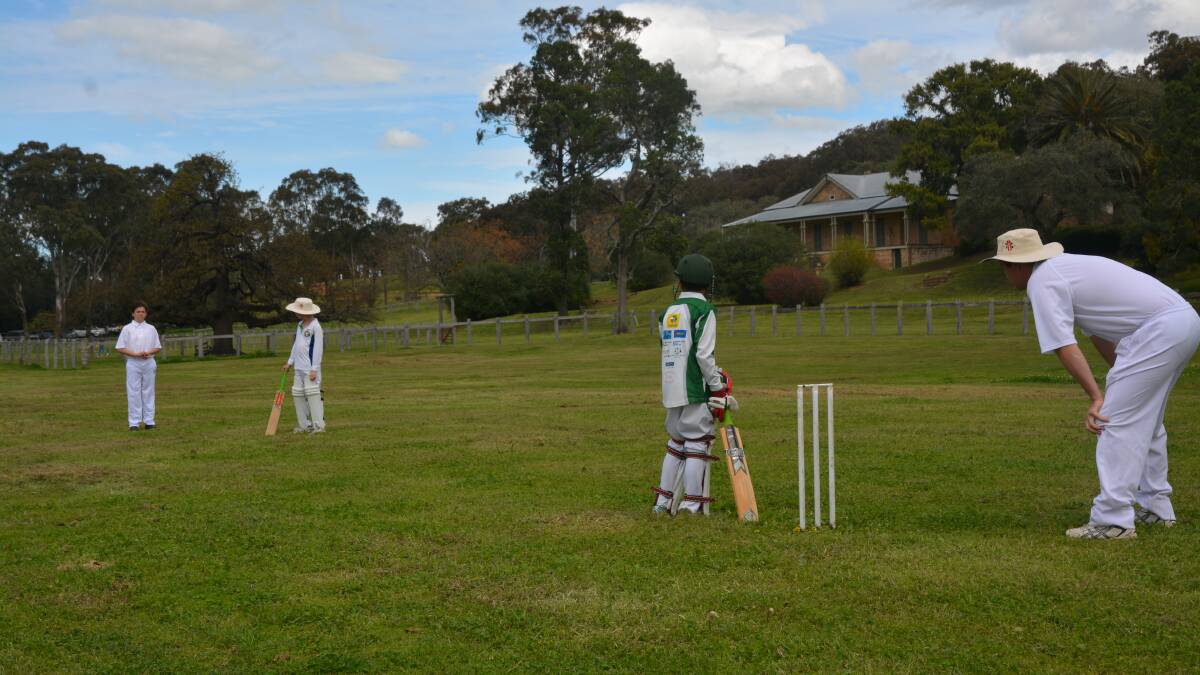 RECREATION: Cricketers re-enact the first photograph of a cricket game taken in Australia at 'Thornthwaite' back in the 1800s.