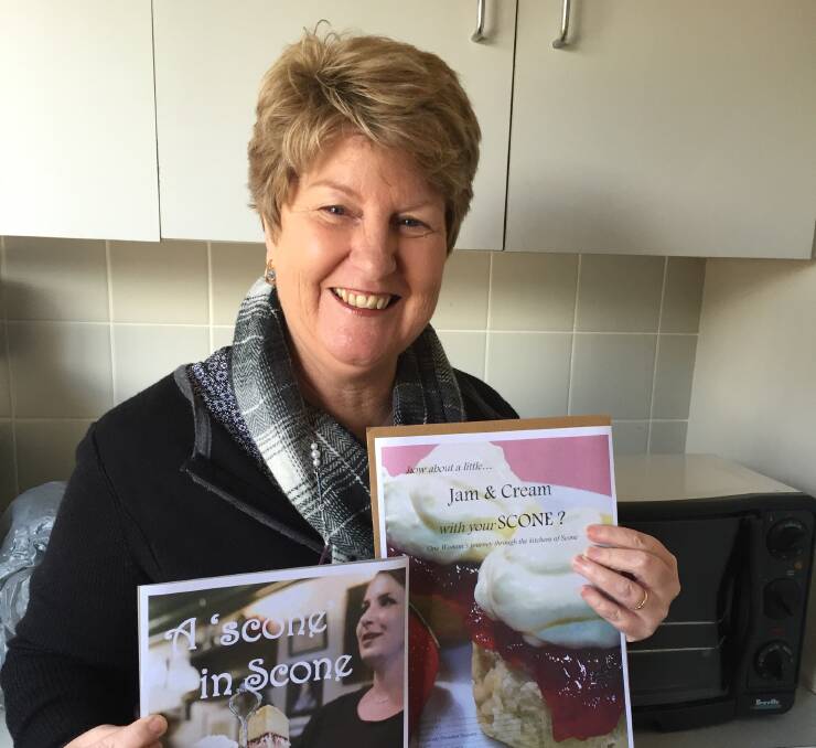 EXCITING: Scone Neighbourhood Centre Manager Lee Watts with the cookbooks.