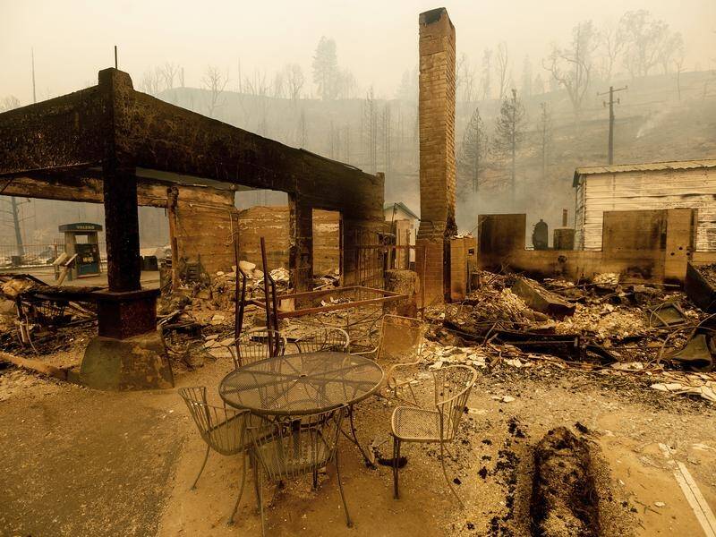 Fires on the US west coast have destroyed towns and homes, and killed at least nine people.