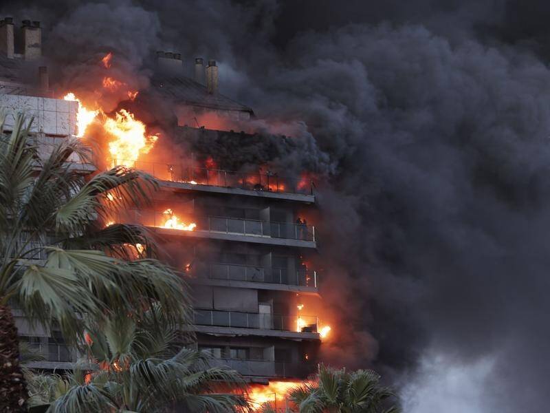 The cause of a fire at a 14-storey residential building in Valencia, Spain, is unknown. (EPA PHOTO)
