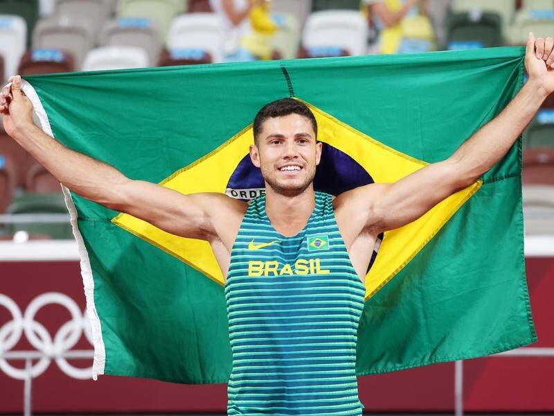 Thiago Braz celebrates back-to-back Olympic medals in Tokyo but is banned from Paris for doping. (EPA PHOTO)
